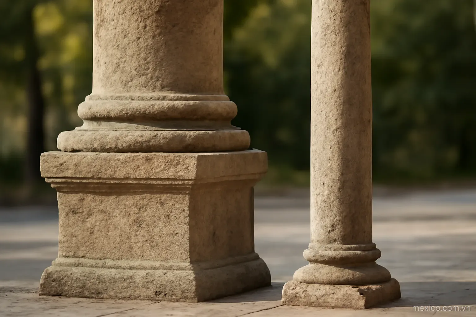 Two stone pillars side by side, one on a wide base and one on a narrow base, side view, no text