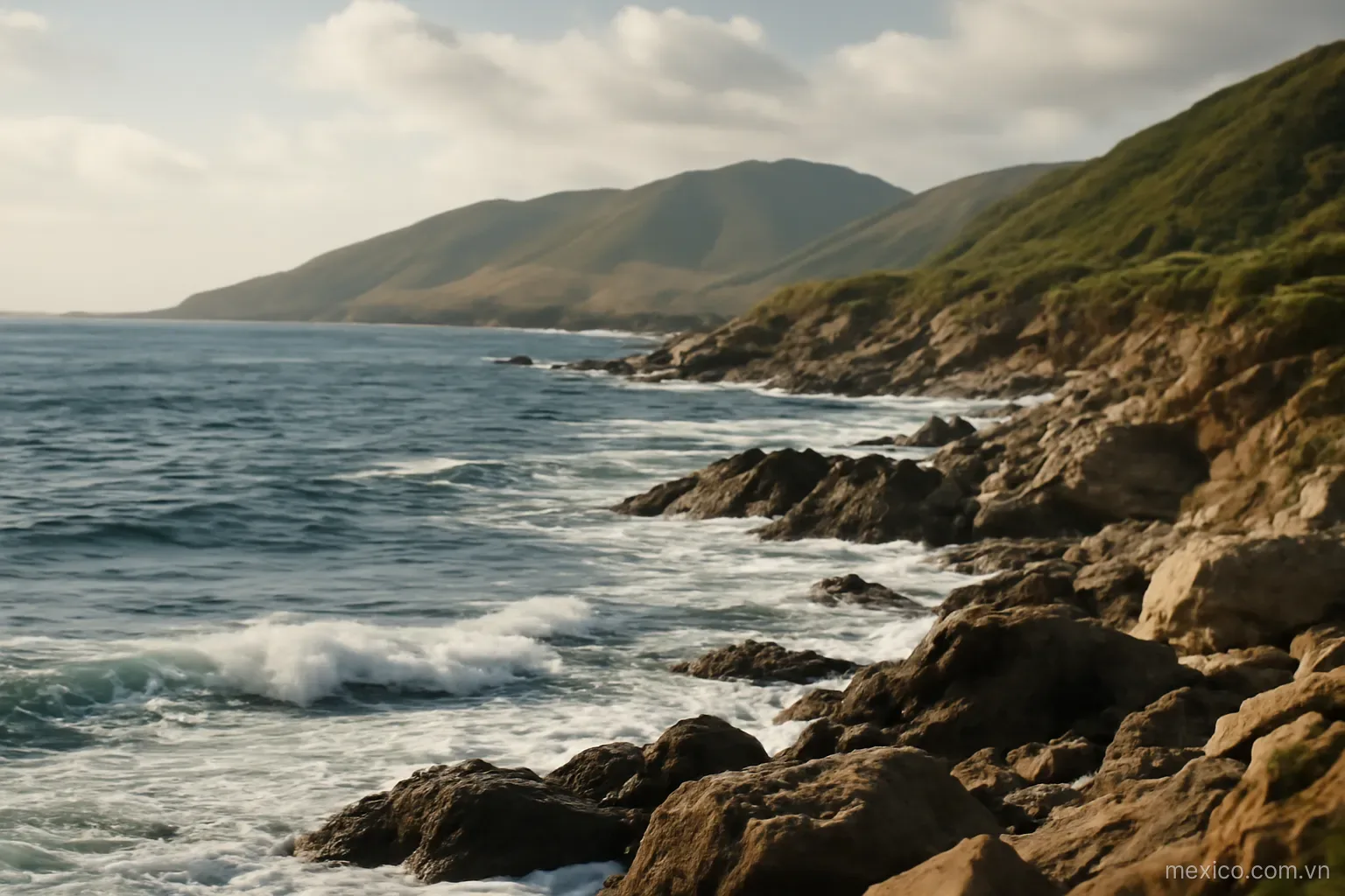 A rocky coastline with waves breaking and hills behind, wide view, no text