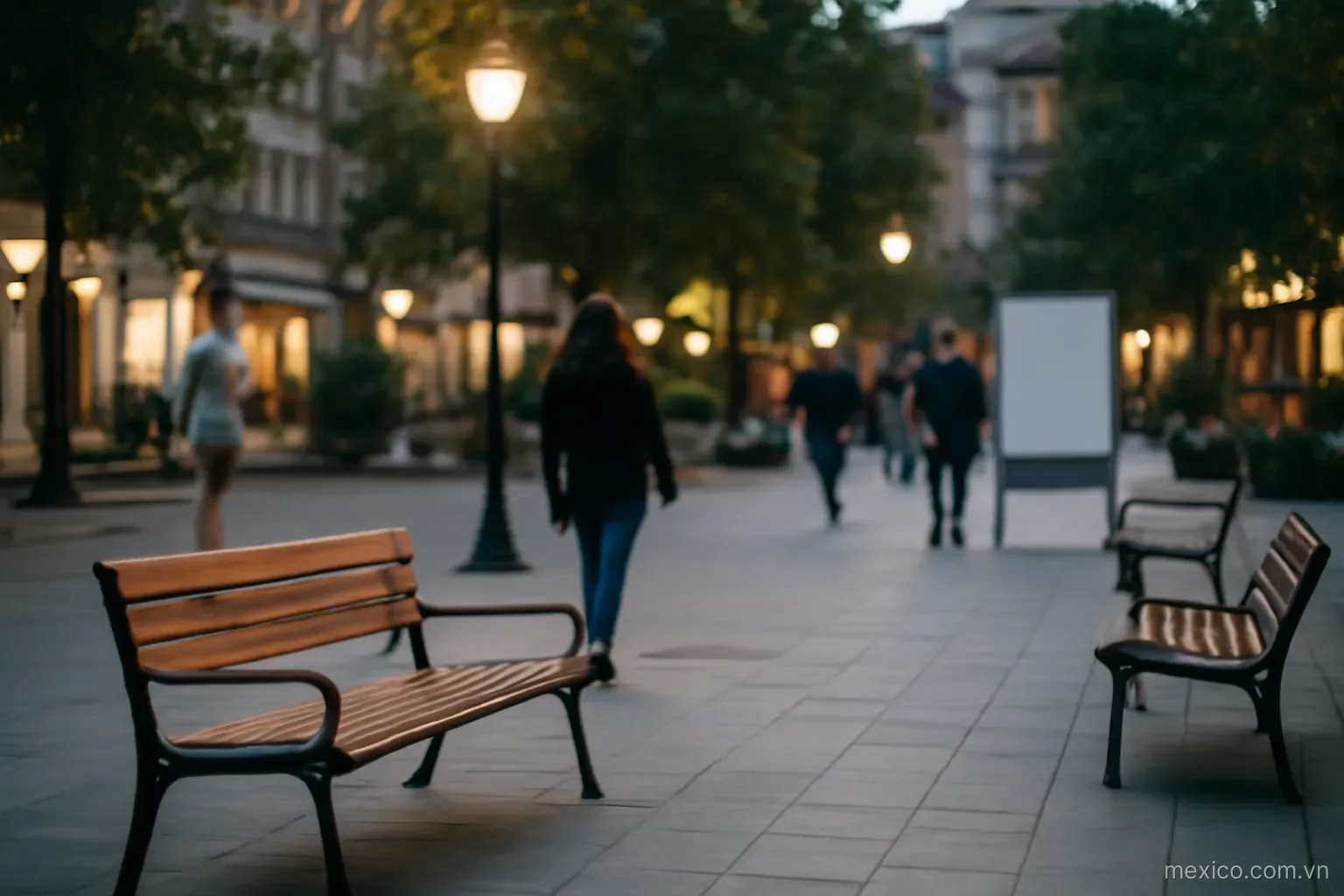 A neighborhood plaza in the evening with benches and people walking, wide view, no text
